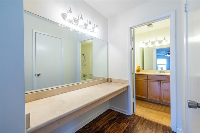1150 Collier Rd NW Unit G8, Atlanta, GA 30318 - bathroom featuring wood finished floors, vanity, a shower, and a ceiling fan