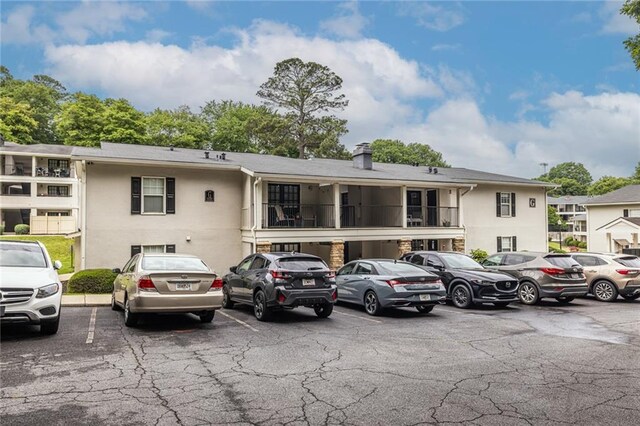 1150 Collier Rd NW Unit G8, Atlanta, GA 30318 - view of property with uncovered parking