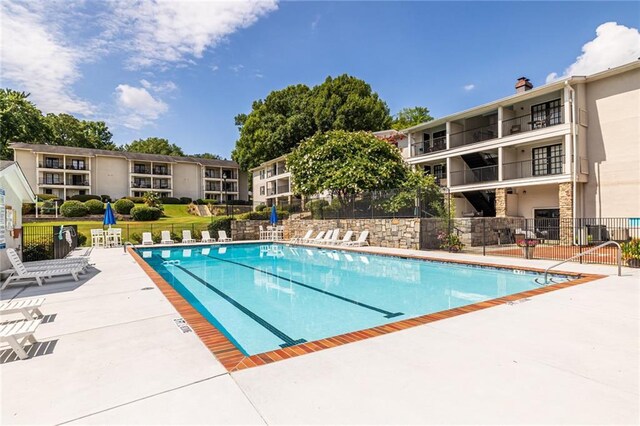 1150 Collier Rd NW Unit G8, Atlanta, GA 30318 - community pool with a patio area