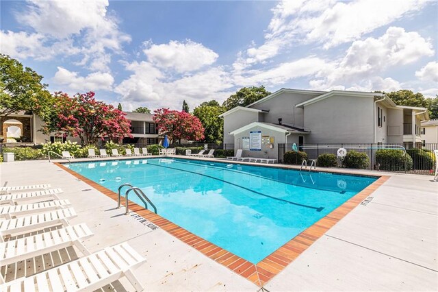 1150 Collier Rd NW Unit G8, Atlanta, GA 30318 - community pool with a patio area