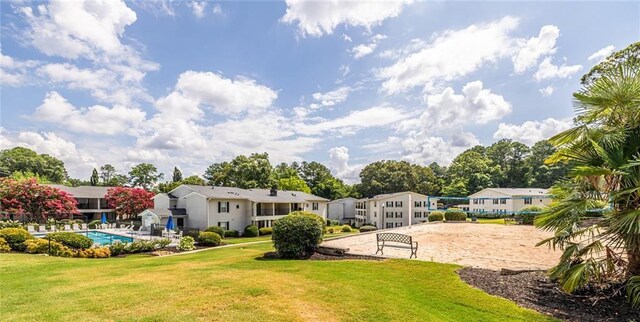 1150 Collier Rd NW Unit G8, Atlanta, GA 30318 - view of grassy yard with volleyball court and a residential view