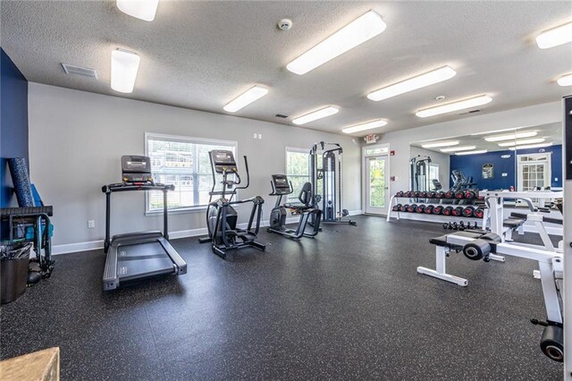 1150 Collier Rd NW Unit G8, Atlanta, GA 30318 - gym featuring baseboards and a textured ceiling