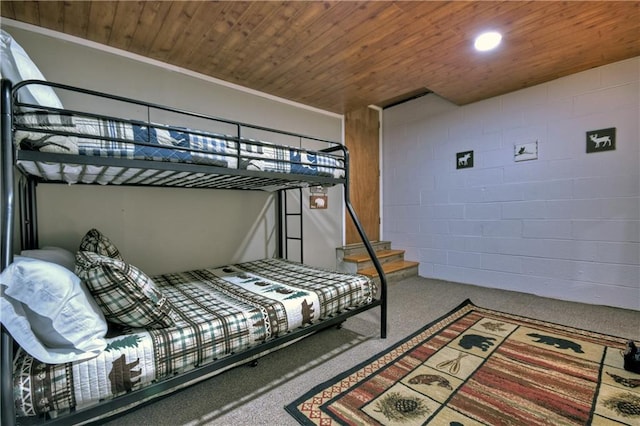 276 Pine Ridge Rd, Ellijay, GA 30536 - carpeted bedroom featuring wood ceiling and concrete block wall