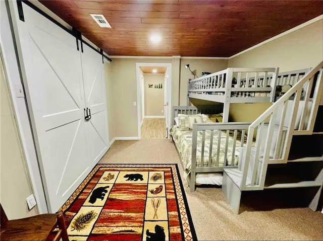 276 Pine Ridge Rd, Ellijay, GA 30536 - bedroom with carpet floors, ornamental molding, and a barn door