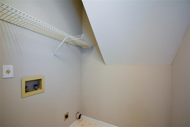 clothes washing area with baseboards, electric dryer hookup, hookup for a washing machine, and laundry area