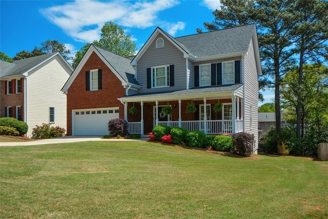 traditional home with a porch, a front lawn, a garage, and concrete driveway