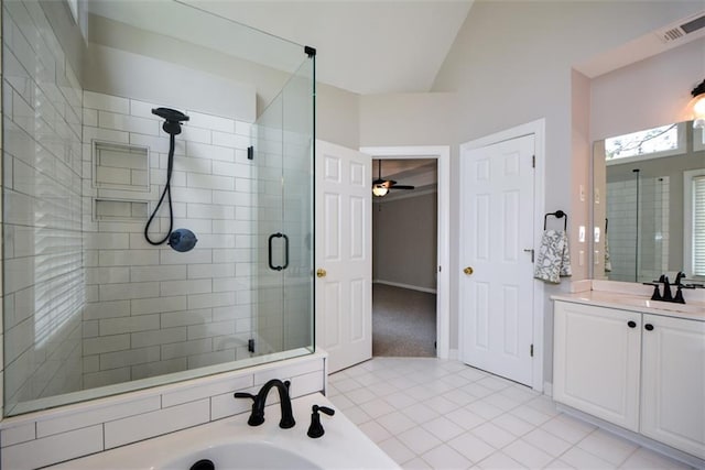 full bath featuring vanity, tile patterned flooring, a shower stall, visible vents, and a tub to relax in