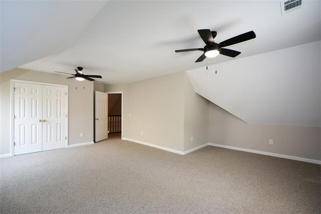 bonus room featuring visible vents, baseboards, a ceiling fan, and carpet floors