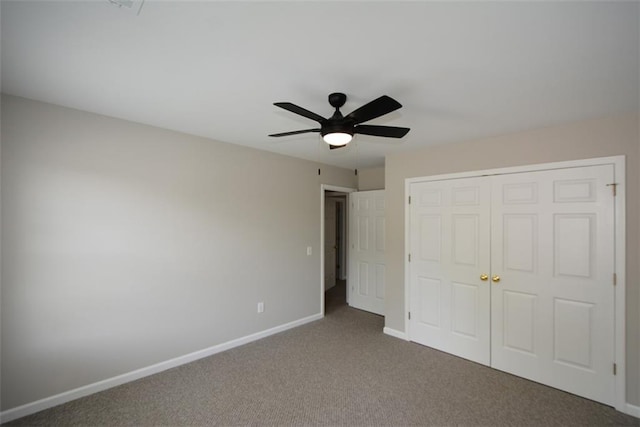 unfurnished bedroom with a closet, baseboards, a ceiling fan, and carpet floors