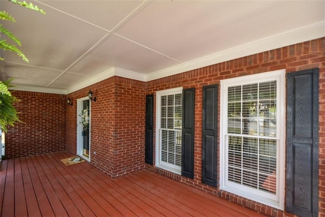 wooden terrace with a porch