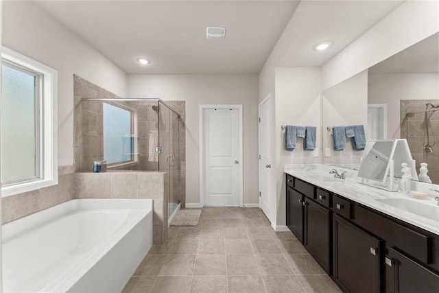 bathroom with vanity, separate shower and tub, and tile patterned flooring