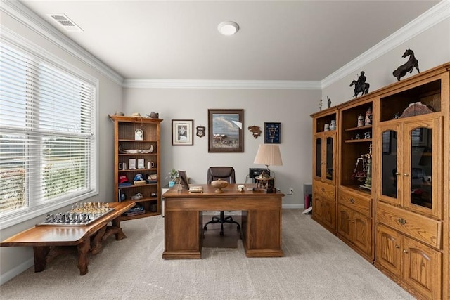 carpeted home office featuring crown molding