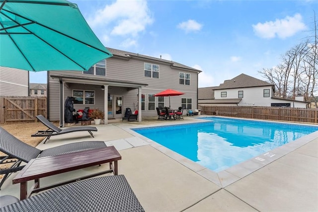 view of swimming pool with a patio