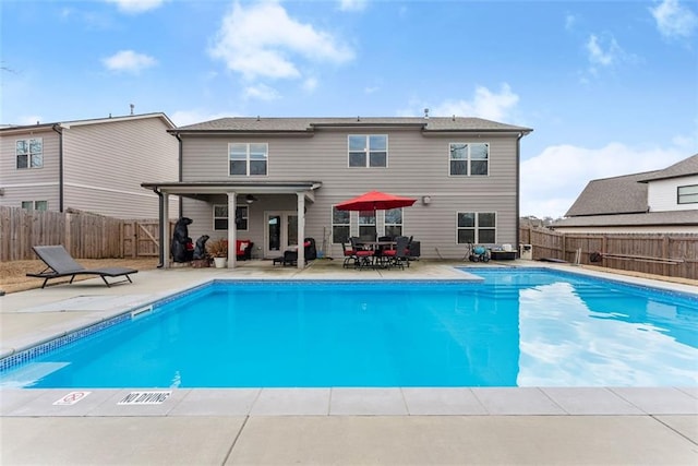 view of pool with a patio area and ceiling fan