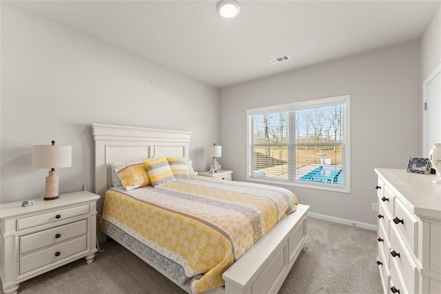 bedroom with light colored carpet