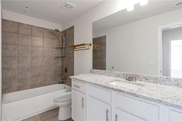 full bathroom with bathtub / shower combination, visible vents, toilet, and tile patterned floors