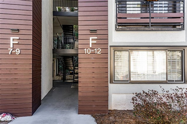 entrance to property featuring a balcony