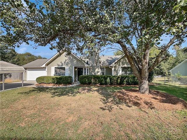 view of front facade featuring a front yard and a garage