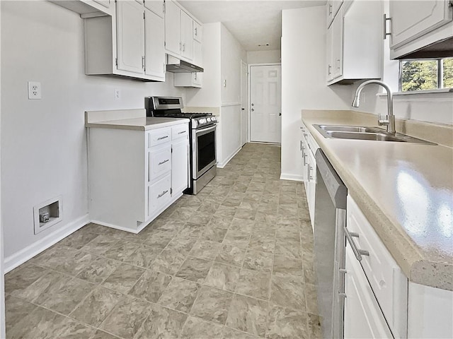 kitchen featuring stainless steel appliances, sink, and white cabinetry