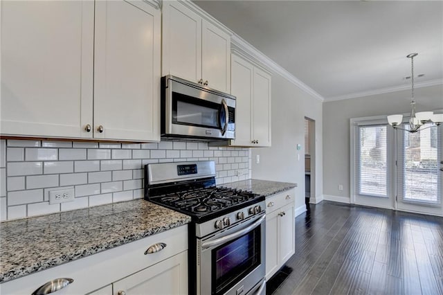 kitchen featuring white cabinetry, light stone countertops, tasteful backsplash, crown molding, and appliances with stainless steel finishes