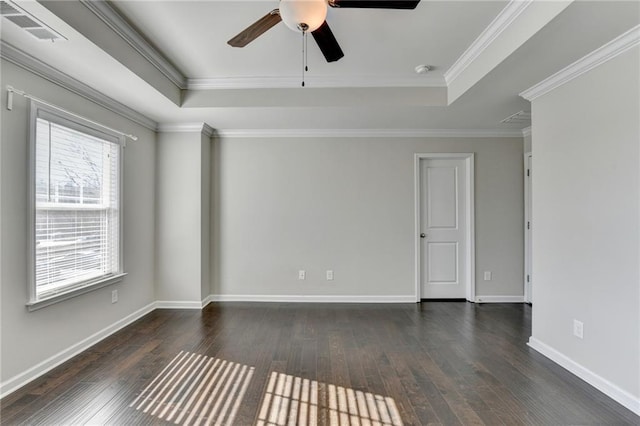 unfurnished room featuring a raised ceiling, ceiling fan, and ornamental molding