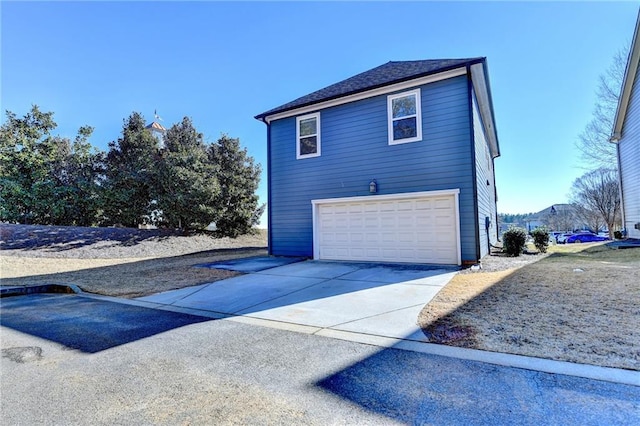 view of side of property featuring a garage