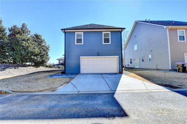 view of property exterior with a garage