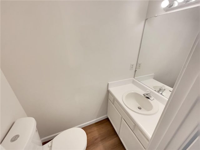 320 Rebecca Lake Way, Fairburn, GA 30213 - bathroom with toilet, vanity, baseboards, and wood finished floors