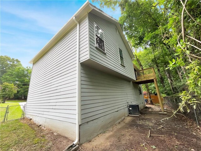 320 Rebecca Lake Way, Fairburn, GA 30213 - view of side of property featuring central air condition unit, a gate, fence, and a deck