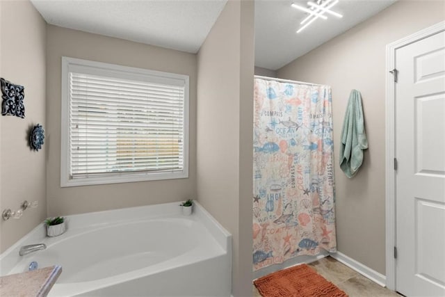 bathroom featuring plus walk in shower and tile patterned floors