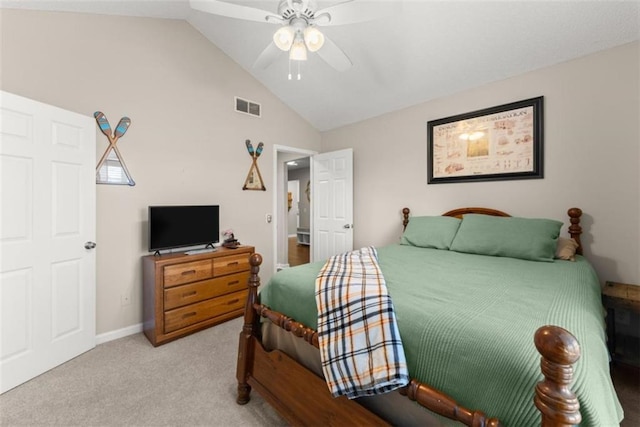 carpeted bedroom with vaulted ceiling and ceiling fan