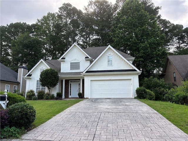 3850 Laurel Dr NW, Acworth, GA 30101 - traditional-style house with driveway, a front yard, and stucco siding