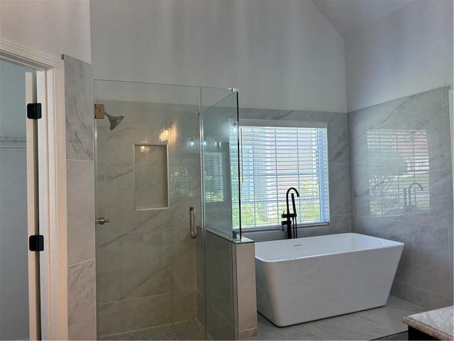 3850 Laurel Dr NW, Acworth, GA 30101 - bathroom with a shower stall, a soaking tub, tile walls, and tile patterned flooring