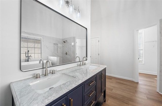 3850 Laurel Dr NW, Acworth, GA 30101 - full bathroom with tiled shower, double vanity, wood finished floors, and a freestanding tub