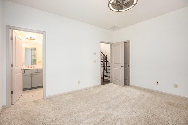 1216 Virginia Ct NE Unit 8, Atlanta, GA 30306 - empty room with light colored carpet, a sink, stairs, and baseboards