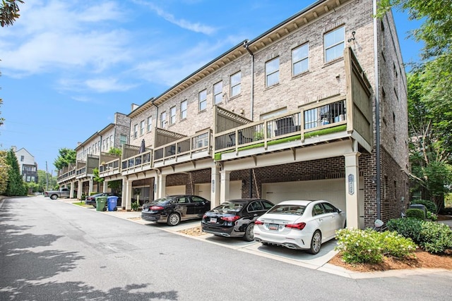 1216 Virginia Ct NE Unit 8, Atlanta, GA 30306 - view of property featuring a garage and driveway