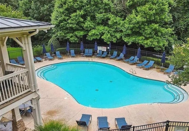 6038 Mayfield Way SE, Mableton, GA 30126 - community pool featuring a patio area and view of scattered trees