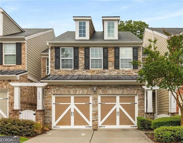 6038 Mayfield Way SE, Mableton, GA 30126 - view of front of home featuring driveway, an attached garage, a standing seam roof, and stone siding