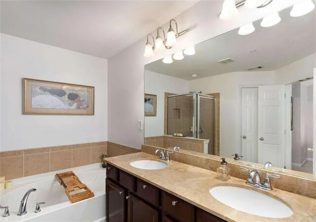 6038 Mayfield Way SE, Mableton, GA 30126 - full bath featuring a garden tub, a shower stall, and double vanity