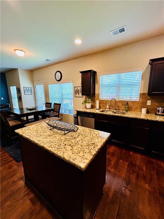 5848 Rex Ridge Loop, Rex, GA 30273 - kitchen with a sink, stainless steel dishwasher, dark wood-type flooring, light stone counters, and recessed lighting
