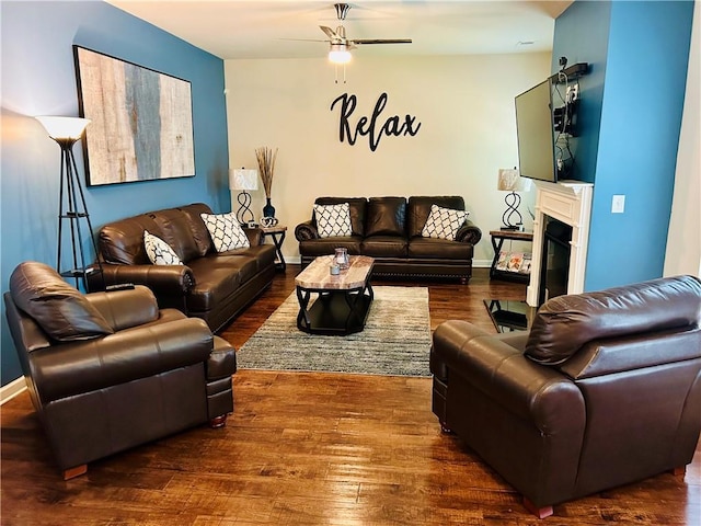 5848 Rex Ridge Loop, Rex, GA 30273 - living room with ceiling fan, wood finished floors, a fireplace with flush hearth, and baseboards