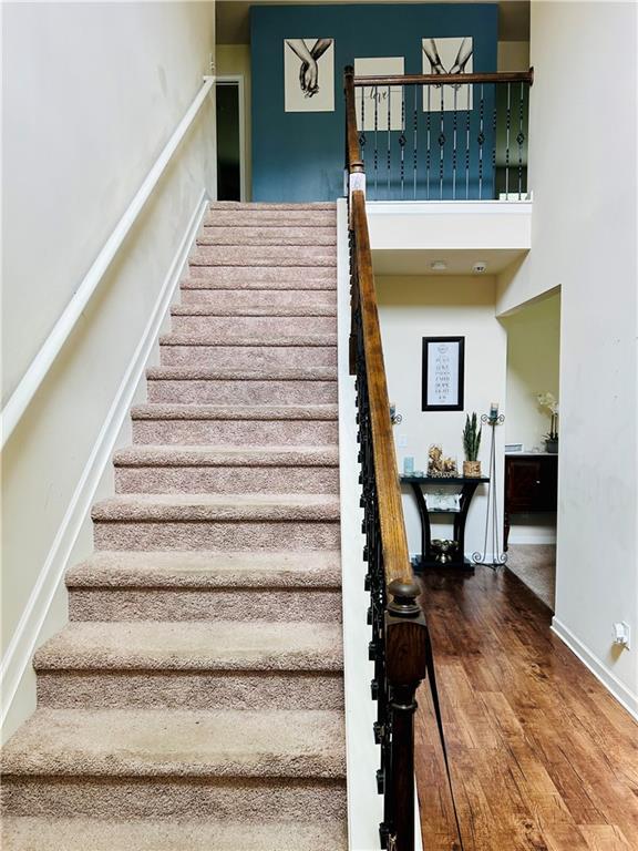 5848 Rex Ridge Loop, Rex, GA 30273 - stairway featuring wood finished floors