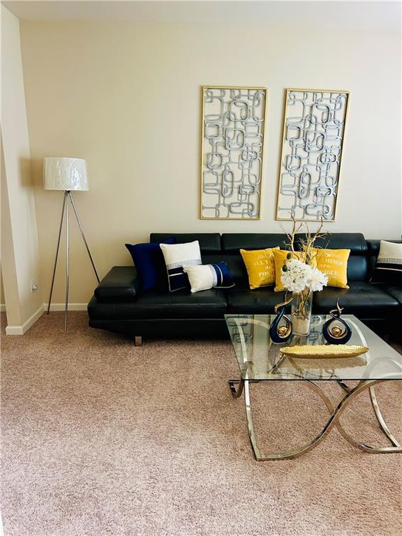 5848 Rex Ridge Loop, Rex, GA 30273 - carpeted living room featuring baseboards