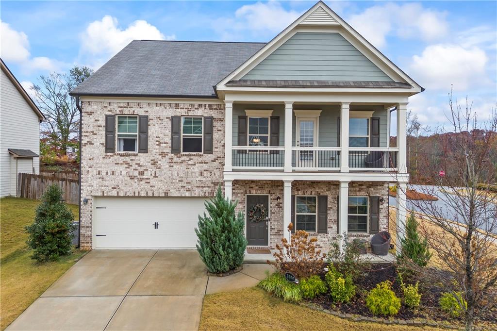 view of front of property with a porch and a garage