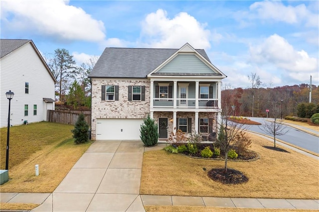 view of front of property with a porch, a garage, a balcony, and a front yard