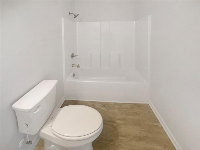 bathroom featuring toilet and shower / washtub combination