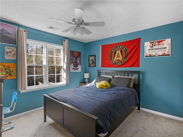 bedroom featuring baseboards, visible vents, and carpet flooring