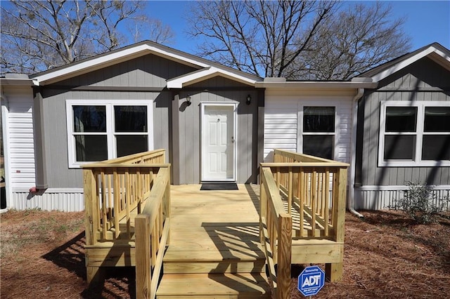 doorway to property with a deck