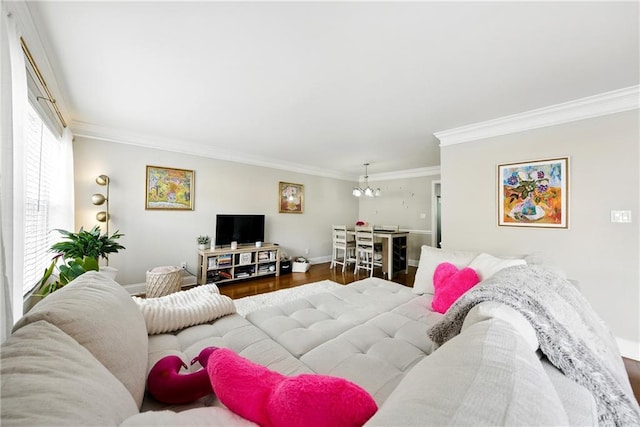 6980 Roswell Rd # A8, Atlanta, GA 30328 - living area with crown molding, a chandelier, baseboards, and wood finished floors