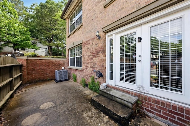 6980 Roswell Rd # A8, Atlanta, GA 30328 - view of patio / terrace with cooling unit, fence, entry steps, and french doors
